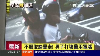 闖紅燈被抓到　男一拳打爆警用電腦