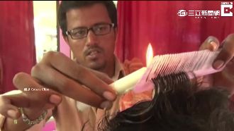 「燒」出新髮型！印度創意燭火剪髮