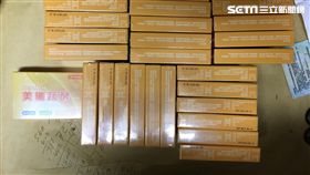 警方前往中央路公寓搗破毒窟，起獲31盒包裝成「美纖蔬酵」減肥酵素的K他命等各式毒品（翻攝畫面）