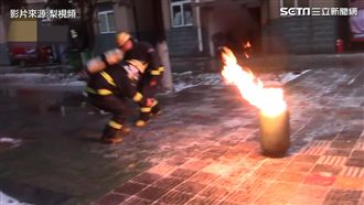 消防員抱起噴火煤瓶　英勇下七層樓
