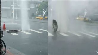 人孔蓋雨中大「爆氣」　水柱白煙噴發