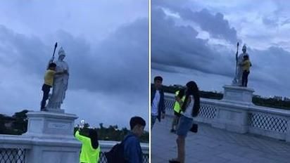 危險又缺德　男爬高高只為與雕像合照