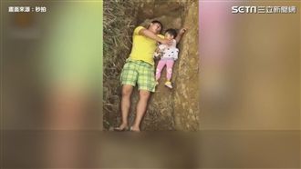 貧父陪2歲重症女躺墳　提前適應死亡