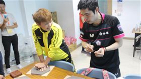 ▲陳思羽與莊智淵留下冠軍手印。（圖／全運會提供）