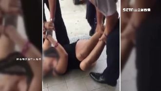 女賊超商行竊耍賴　「扛乳豬」式帶離