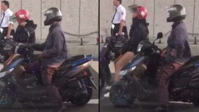 熱褲辣妹停一旁　騎士竟當街掏槍抖動