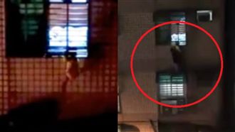 女孩卡鐵窗哭聲淒厲　鄰爬遮雨棚救援