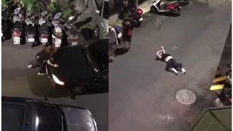 她深夜「起乩作法」　猛拍車頭躺地滾