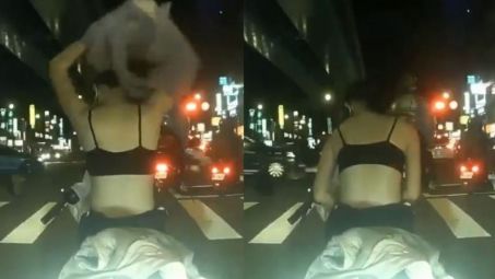 女騎士紅燈脫衣換裝曝美背…旁男驚呆