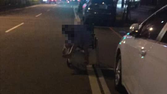 輪椅女疑遭丟包馬路　他暖心肉身保護
