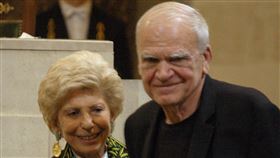 FILE - In this June 10, 2009, file photo, Czech-born author living in France Milan Kundera, right, is awarded the Simone and Cino Del Duca Foundation World Prize for his lifetime achievement in Paris,