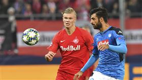 Salzburg's Erling Braut Haaland, left, duels for the ball against Napoli's Sebastiano Luperto during the Champions League Group E soccer match between FC Red Bull Salzburg and Napoli in Salzburg, Aust