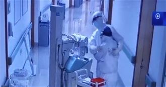 隔離衣下眼神認人　醫護夫妻相擁打氣