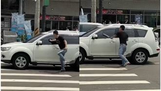 男當街狂敲車窗叫囂　瞄到警車急落跑