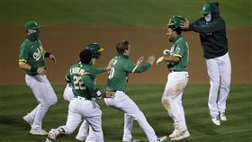 ▲歷經4次突破僵局，運動家和太空人說再見。（圖／美聯社／達志影像）