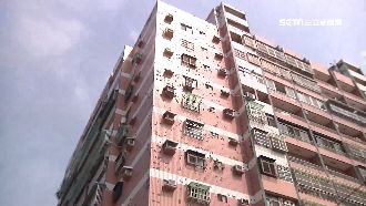 花花臉大樓狂落磚　掛漁網攔截成奇觀