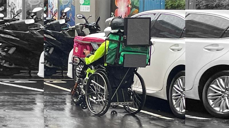 生命鬥士！豪大雨中仍堅持坐輪椅送餐