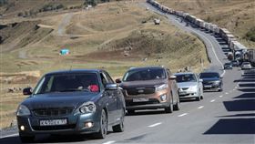 俄國人逃到喬治亞。（圖／路透社／達志影像）