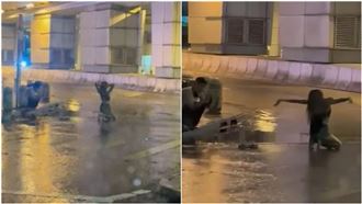 颱風天拍網美照？女跪地濕身秀　網全看傻