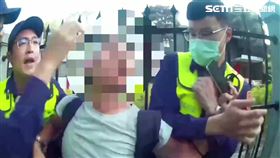 北市劉女持手機對著總統官邸拍照，經勸阻不聽還辱罵警員遭逮送辦。（圖／翻攝畫面）