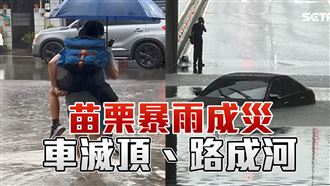 雨彈狂炸馬路變小河　慈父揹兒涉水上學