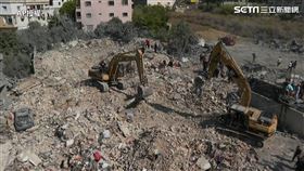 中東戰火持續，圖為以色列空襲黎巴嫩後，黎巴嫩當地進行搜救。（圖／AP授權）