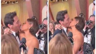 奧斯卡紅毯震撼　一吻22年恩怨終結