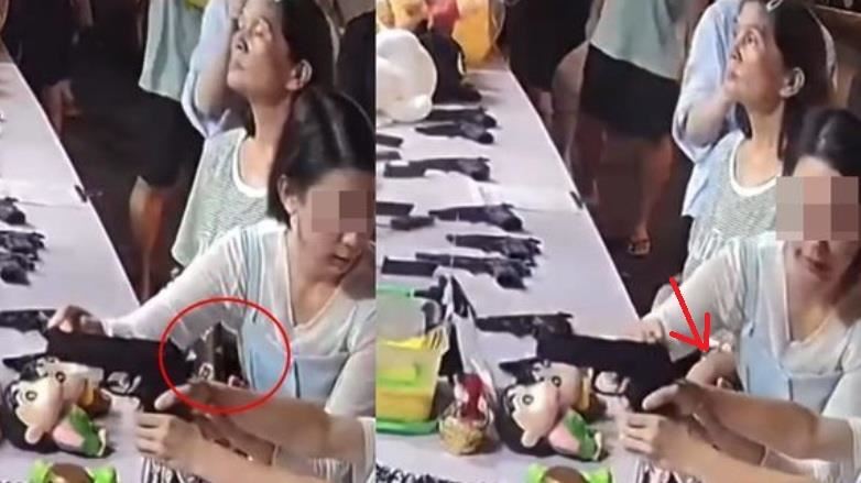 一名63歲的胡姓婦人假裝對遊戲攤位感興趣，趁著這位母親全神貫注地指導孩子時，悄悄地將手伸進她的包包，神不知鬼不覺地偷走皮夾。（圖／翻攝畫面）