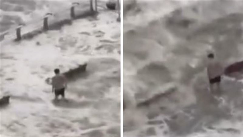 樺加沙重創香港　男子穿泳褲雨中戲水