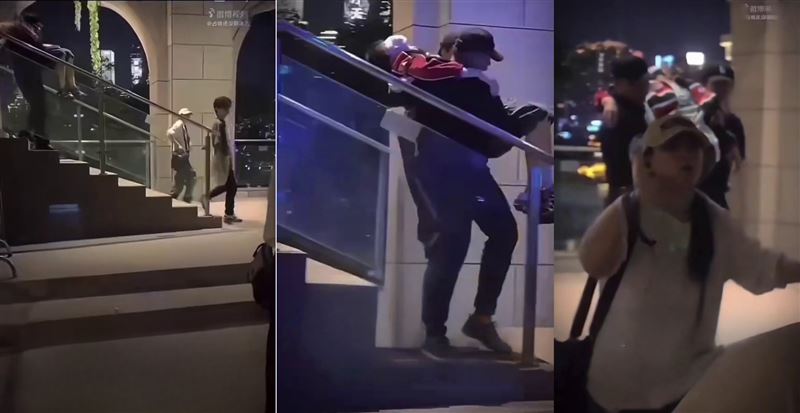 疑當晚現場送醫畫面曝光,只見多人將一紅衣男子抬下樓梯。(圖/翻攝自抖音)