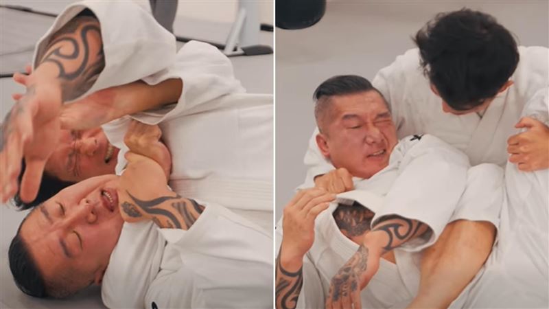 黃國昌一度壓制館長，兩人似乎使盡全力、表情猙獰。（圖／翻攝自飆捍臉書）