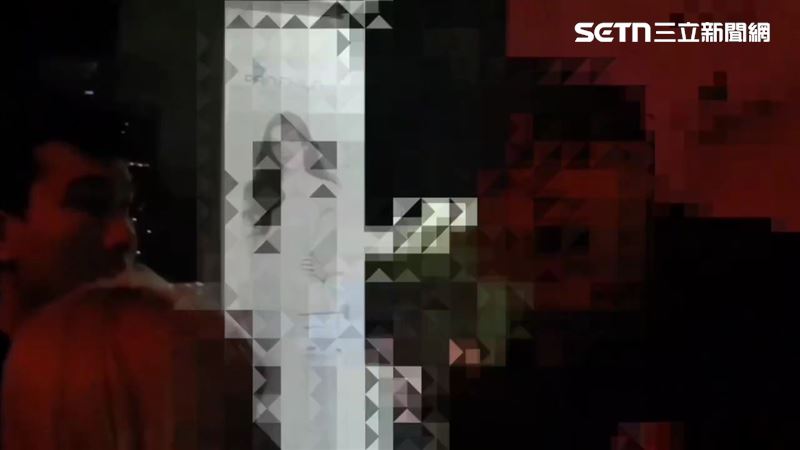 北市李男在夜店打烊後仍不願離去，不但咬傷安管人員，還對著警員嗆聲。（圖／翻攝畫面）