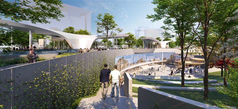 捷運出入口以流線型曲線屋頂造型呈現，不僅具備遮陽避雨功能，更與公園地景自然銜接，強化整體景觀特色。（圖／台北市捷運局提供）