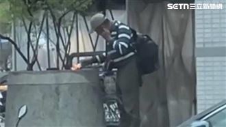 台中男賣場外「燒紙+頭撞牆」　住戶嚇壞