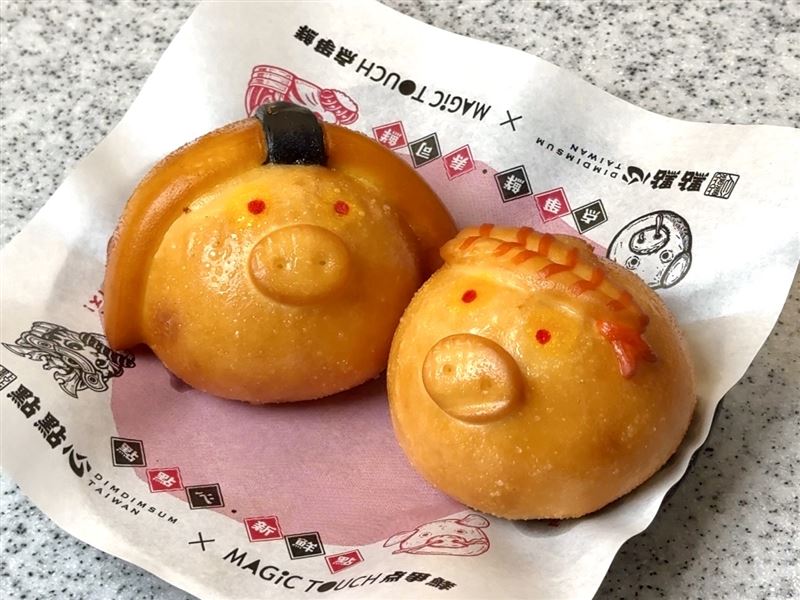 點點心招牌必吃的「豬仔流沙包」驚喜變身，可愛小豬戴上鮮蝦與玉子燒造型頭套，外層炸至金黃酥脆，此款於点爭鮮販售。（圖／品牌業者提供）