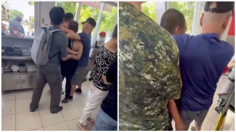 李男情緒激動在現場摔東西,目擊者見狀趕緊上前勸阻。(圖/翻攝自Threads @amber_10.02)