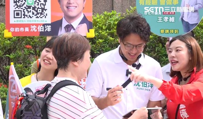 沈伯洋東湖五分市場拜票，民眾拿iPad要簽名（圖／翻攝畫面）