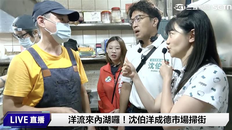 攤商詢問沈伯洋振興傳統市場的問題,沈伯洋沒有迴避,當場解答