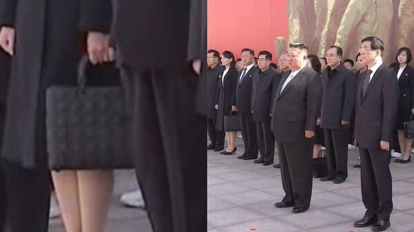 金正恩胞妹金與正身穿簡約黑色服裝、手提黑色皮革包,成為現場嬌點。(圖/翻攝央視新聞聯播)